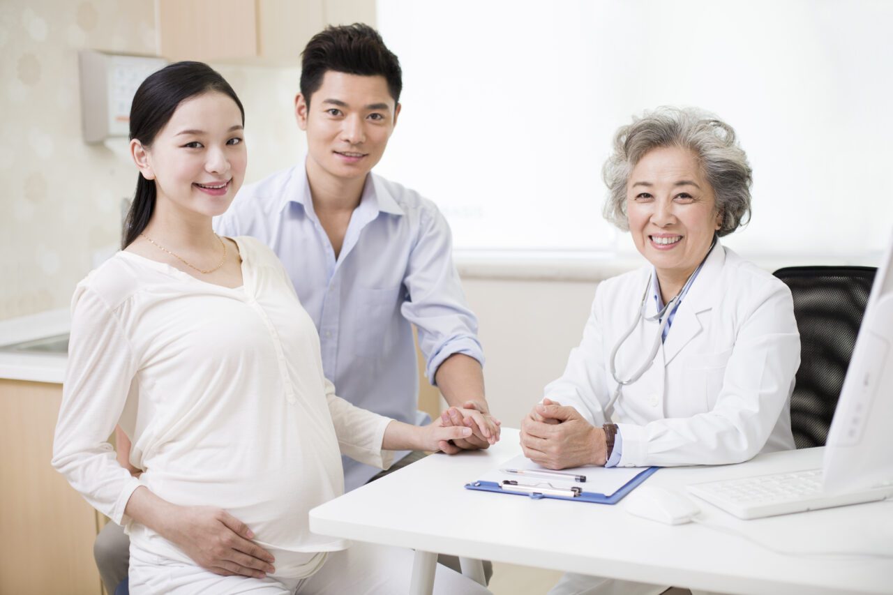 young-couple-receiving-antenatal-care-in-hospital-e1699525344137.jpg
